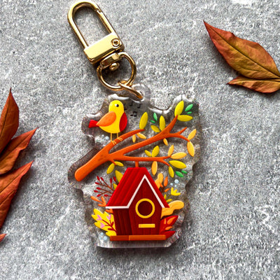 Autumn birdhouse transparent acrylic keychain. Double-sided, backside is the same design, but reversed.