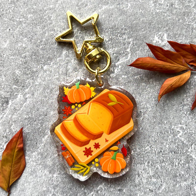 Autumn pumpkin bread transparent acrylic keychain. Double-sided, backside is the same design, but reversed.